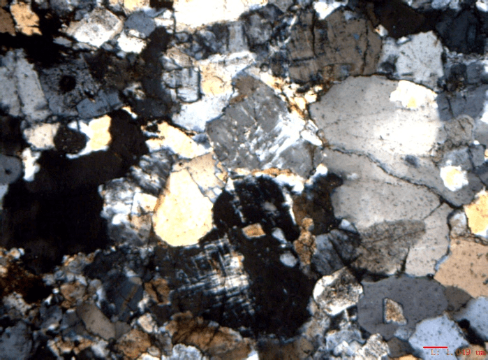 Figure 2. Polarizing microscope images of Dongargarh granite showing the presence of quartz, feldspar, biotite, zircon, magnetite, and ilmenite; Credit. Author